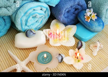 Towels, soaps, flowers, candles Stock Photo