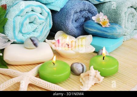 Towels, soaps, flowers, candles Stock Photo