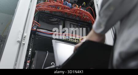 IT expert checking supercomputer server Stock Photo