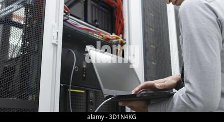IT expert checking supercomputer server Stock Photo