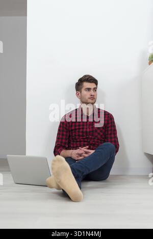 Young hipster businessman working from home freelancing Stock Photo