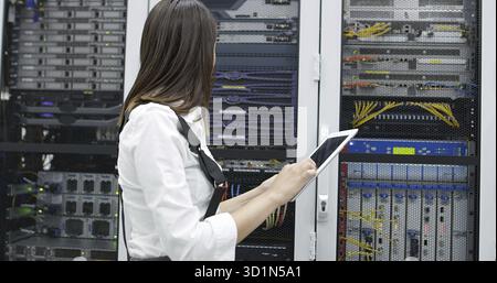 Female administrator at server room Stock Photo