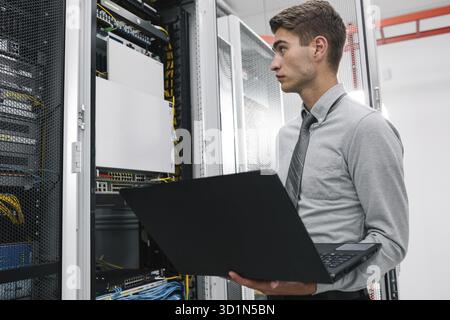 IT expert checking supercomputer server Stock Photo
