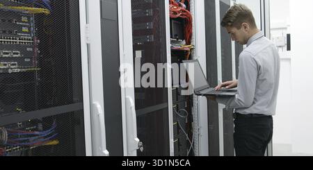 IT expert checking supercomputer server Stock Photo