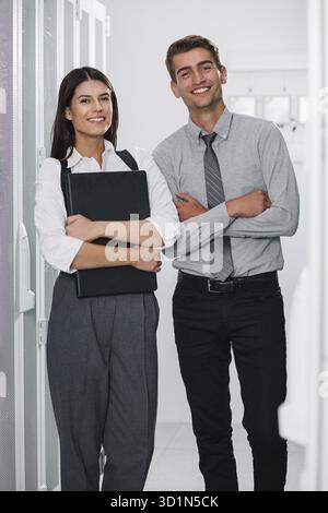 Two IT Engineers in Data Center, Server Room Stock Photo