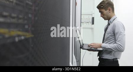 IT expert checking supercomputer server Stock Photo