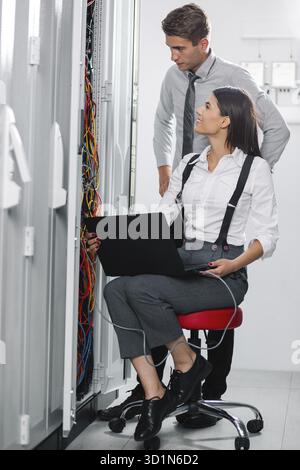IT expert checking supercomputer server Stock Photo