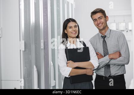 Team of busienss people working in server room Stock Photo