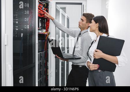 IT expert checking supercomputer server Stock Photo