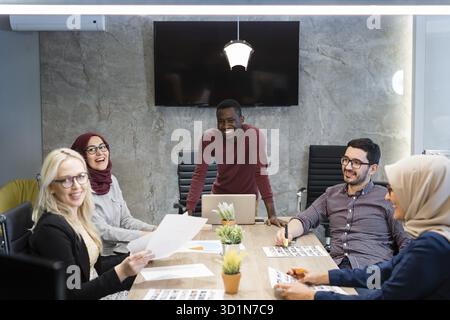 Diverse colleagues discussing on a meeting in office. Colleagues brainstorming on new business ideas in office Stock Photo
