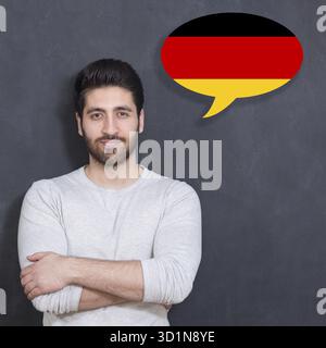 Man learn speaking german in bubble on chalkboard Stock Photo