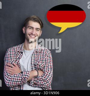 Man learn speaking german in bubble on chalkboard Stock Photo