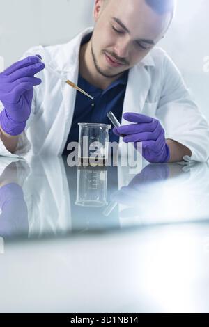 Cheerful young researchers are working in lab Stock Photo