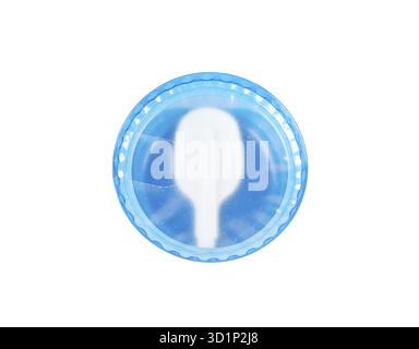 Folding white disposable plastic spoon in yogurt cap isolated on white background Stock Photo
