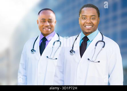 African American Male Doctors Outside of Hospital Building Stock Photo