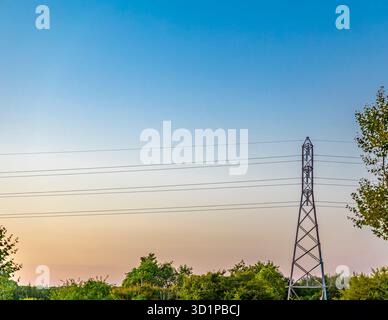 steel pylon and electric lines on a late summer day in long island, ny Stock Photo