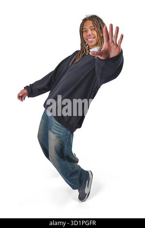 Young man with dreadlocks dancing happily with eyes closed, isolated on white background Stock Photo