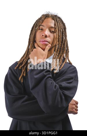 Young man with dreadlocks on a white background, contemplating thoughtfully Stock Photo