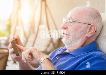 Senior Adult Man Using Smart Cell Phone. Stock Photo