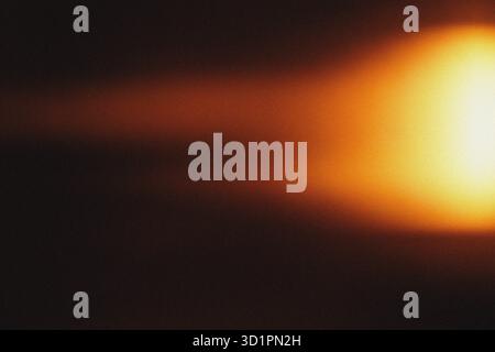 Red light effect on black background. Abstract wallpaper. Analog film effect. Blurred defocused. Lo-fi effect Stock Photo