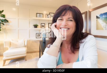 Attractive Middle Aged Woman Portrait Inside Her Home Office Stock Photo