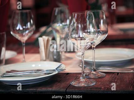 Empty set of glass and plates at restaurant Stock Photo