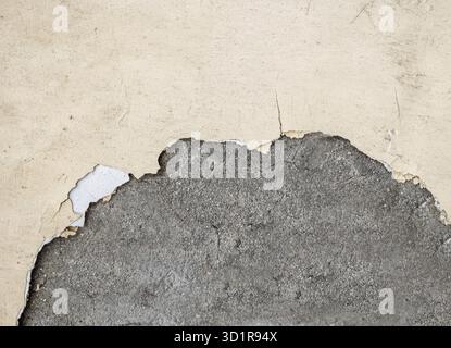 Wall half damaged plaster painted in mad yellow color. A lot of space for text, copyspace Stock Photo