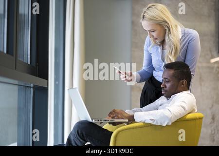 Colleagues working together. Multiracial teamwork concept Stock Photo
