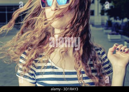 Happy redhead women shaking her head. Summertime fun and happyness Stock Photo