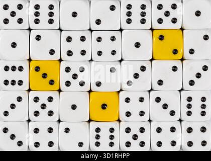 Background of random ordered white dices with three yellow cubes Stock Photo