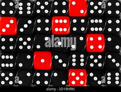 Background of random ordered black dices with six red cubes Stock Photo