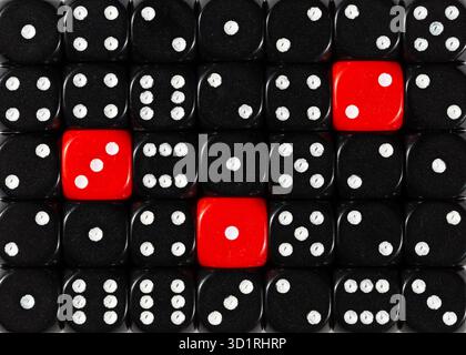 Background of random ordered black dices with three red cubes Stock Photo