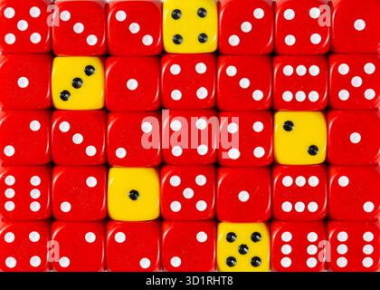 Background of random ordered red dices with five yellow cubes Stock Photo