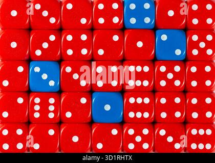 Background of random ordered red dices with four blue cubes Stock Photo
