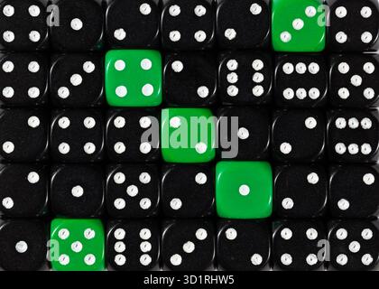 Background of random ordered black dices with five green cubes Stock Photo