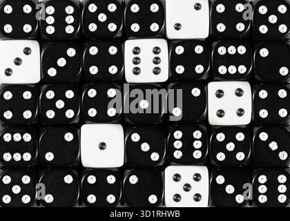 Background of random ordered black dices with six white cubes Stock Photo