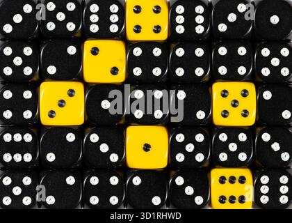 Background of random ordered black dices with six yellow cubes Stock Photo