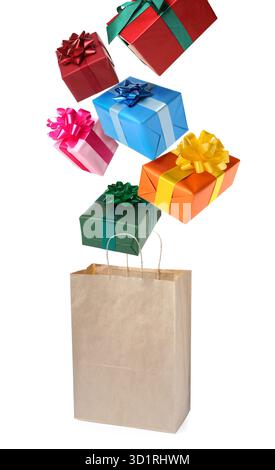 Many gift boxes falling into paper bag on white background Stock Photo