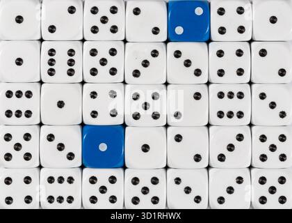 Background of random ordered white dices with two blue cubes Stock Photo