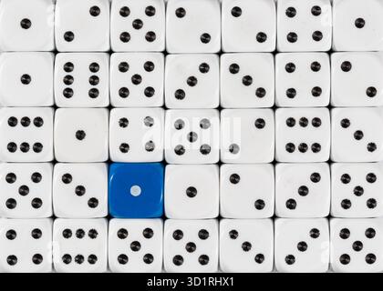 Background of random ordered white dices with one blue cube Stock Photo