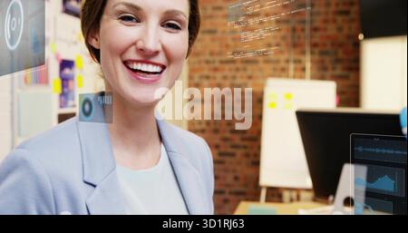 Smiling female developer presenting code overlays in office on whiteboard and monitor, copy space Stock Photo