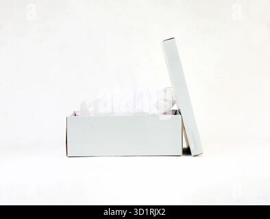 Minimalist Open White Gift Box with Tissue Paper on Clean Background Stock Photo