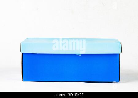 Closed Blue Craft Cardboard Box on White Background Stock Photo