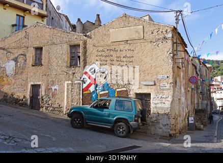 old houses and street murals in Orgosolo, Barbagia, Sardinia, Italy Stock Photo