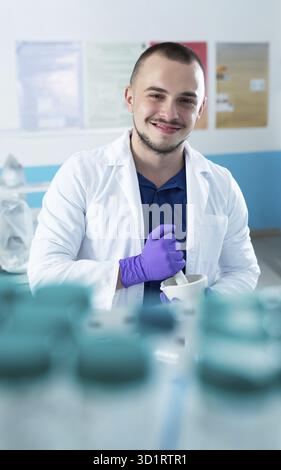 Cheerful young researchers are working in lab Stock Photo