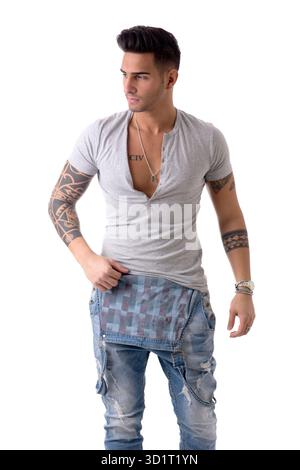 Young man wearing denim overalls and white t-shirt Stock Photo