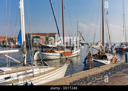 Historic sailing ships leaving harbor of Urk, The Netherlands Stock Photo