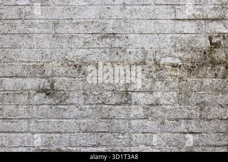 Background weathered brick wall with white plastering Stock Photo