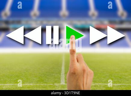 hand pressed to play video the sport play online Stock Photo
