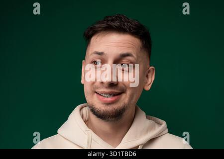 Smiling Man in White Hoodie Stock Photo
